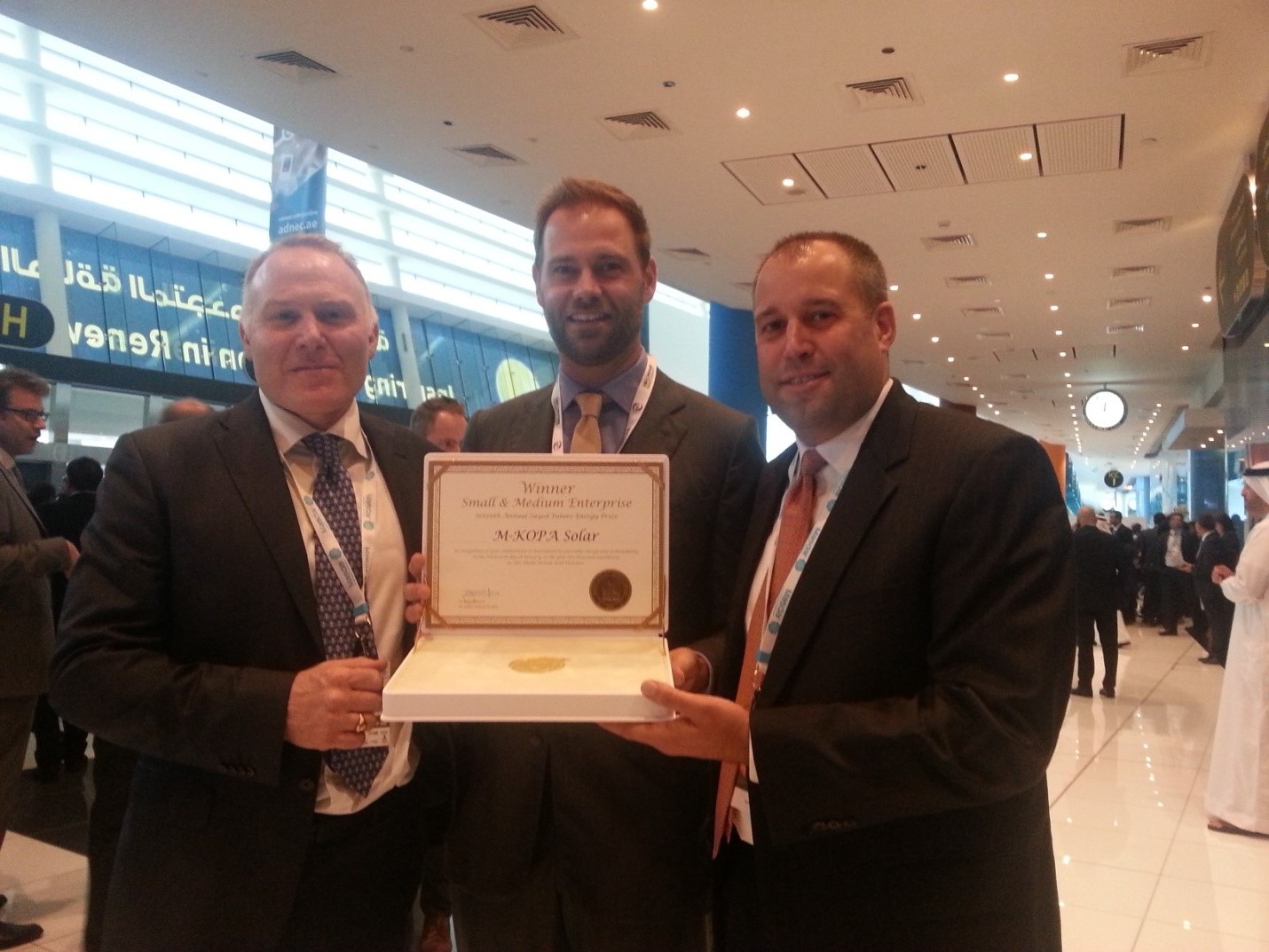 From Left to right: M-KOPA Solar Executive Chairman Nick Hughes with Jesse Moore Managing Director, and Chad Larson, Finance Director display the award certificate after winning in the SME Category of Zayed Future Energy Prize 2015. M-KOPA Solar was recognized for its ‘pay-as-you-go’ energy services for off grid customers that combine mobile payments with GSM sensor technology to enable the leasing of solar power systems. 