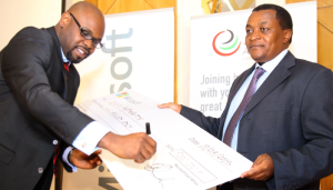 Signing the dummy cheque is Kunle Awosika, Country Manager Microsoft Kenya and holding on to the cheque is Victor Kyalo, CEO ICT Authority.