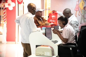 Airtel Customer Service Executived attend to customers at the new Embu shop.