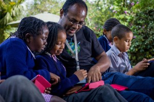 IBM Research Scientist, Dr Kommy Weldemariam with pupils from Riara School, Nairobi exploring how technology can help improve educational outcomes