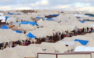 Families at a makeshift camp for displaced Syrian refugees, set up along the Turkish border close to the village of Atme.