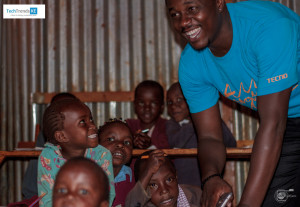 TECNO Mobile Retail Head and training manager Dickson Ireri interacts with the children at ARISE Children's home