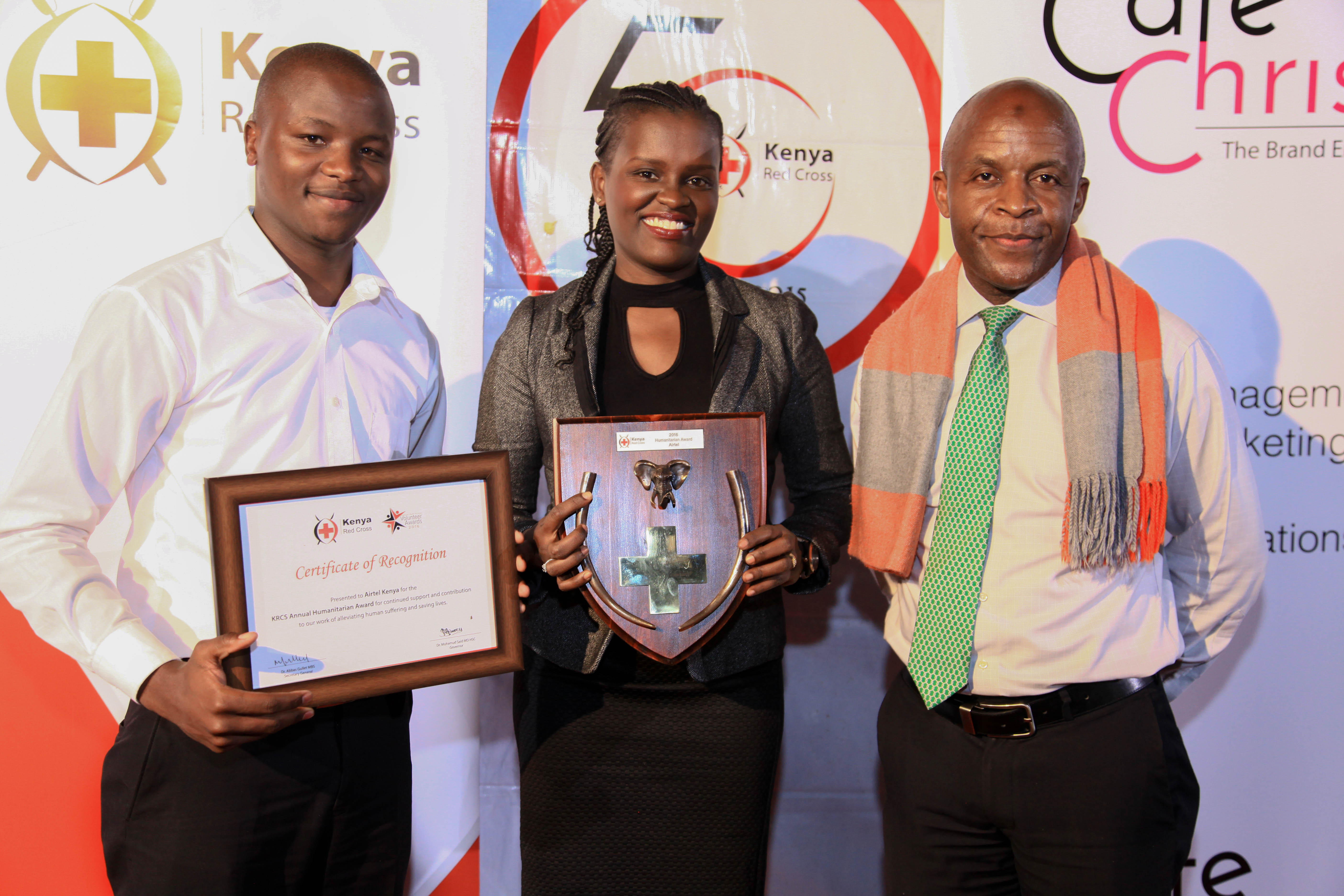 From Left- Airtel Kenya's Communications Executive Jesse Kisenya and CSR Manager Aigeldel Kirumburu receive the Kenya Red Cross Annual Humanitarian Award from IFRC Gender Coodinator Nkhoma Potipher.