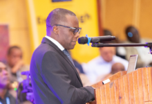 Chief Secretary Ambassador Moses Kusiluka speaks to senior officials at the 6th e-Government Annual Work Meeting in Arusha on February 17, 2026.