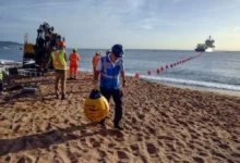 Engineers guide a subsea fiber cable ashore during a landing operation for the 2Africa network, part of the massive system designed to expand high-capacity internet connectivity across Africa, Europe, and Asia.