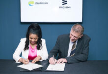Frehiwot Tamru, CEO of Ethio Telecom, signs a network expansion agreement with a senior executive from Ericsson during vendor negotiations linked to Mobile World Congress 2026 in Barcelona.
