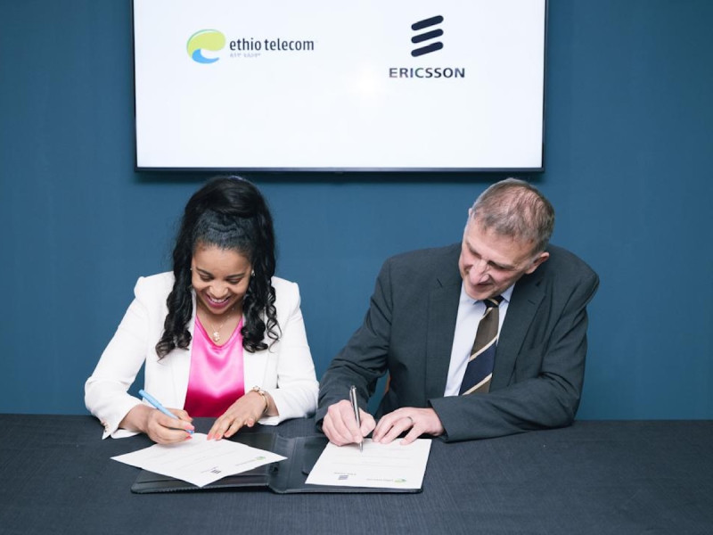 Frehiwot Tamru, CEO of Ethio Telecom, signs a network expansion agreement with a senior executive from Ericsson during vendor negotiations linked to Mobile World Congress 2026 in Barcelona.