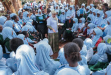 Iladho Galgallo speaks with students during a STEM mentorship session at Moi Girls High School Marsabit, encouraging girls to consider careers in technology and engineering.