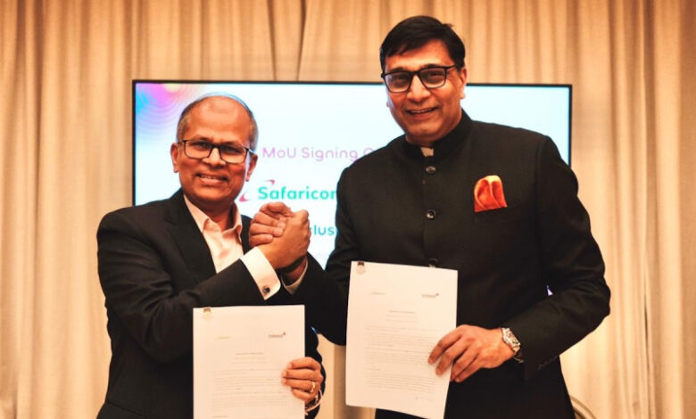 Executives from Indosat Ooredoo Hutchison and Safaricom hold signed documents during the Memorandum of Understanding ceremony announcing a partnership focused on artificial intelligence applications and financial technology collaboration aimed at improving digital customer experiences.