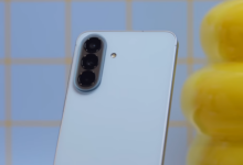 Rear view of the Samsung Galaxy A57 5G in icy blue, showing the vertical triple-camera layout and refined midrange design language.