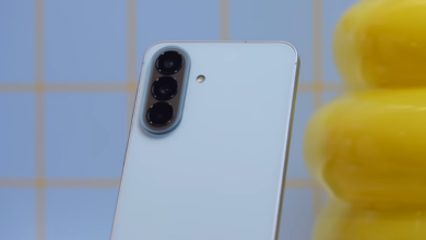 Rear view of the Samsung Galaxy A57 5G in icy blue, showing the vertical triple-camera layout and refined midrange design language.