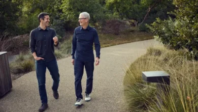 John Ternus (left) and Tim Cook walk together during a transition period that will see Ternus take over as CEO of Apple later this year.