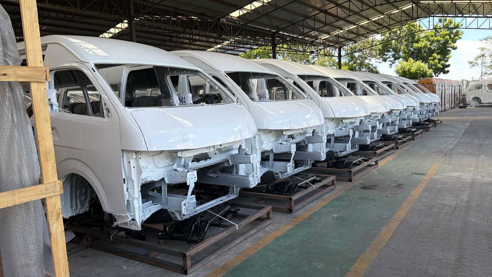 Partially assembled Ma3e electric vans at Associated Vehicle Assemblers in Mombasa, where BasiGo has begun local assembly using CKD kits.