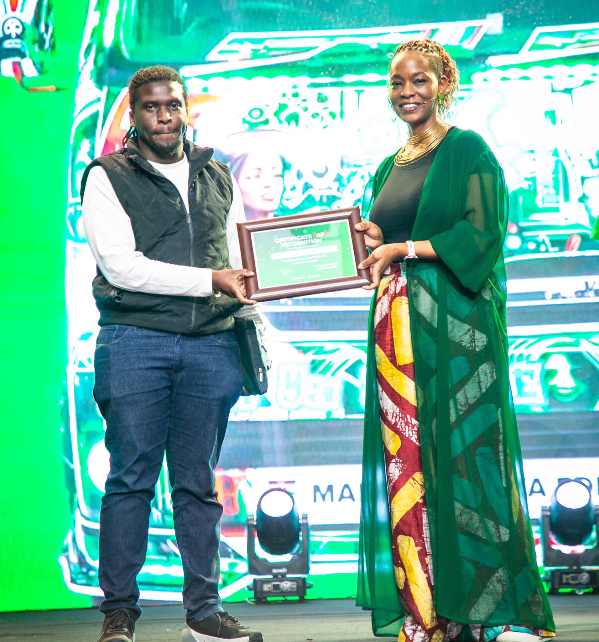 Esther Waititu awards Roamtech Solutions for Excellence in M-PESA API Traffic Generation at the M-PESA Daraja Awards, recognising its role in enabling high-volume, reliable payment flows across businesses.