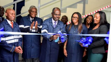 Habil Olaka and SecureID founder Kofo Akinkugbe join directors at a ribbon-cutting ceremony marking the opening of the smart card production facility in Nairobi.