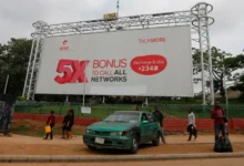 An Airtel advertising billboard stands along a roadside in Lagos, Nigeria. Bharti Airtel is increasing its stake in Airtel Africa through a share swap transaction tied to its African operations.