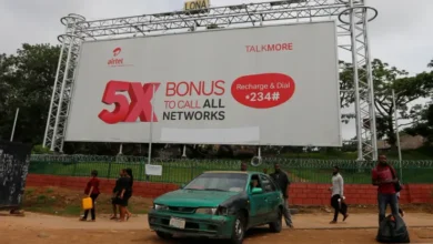 An Airtel advertising billboard stands along a roadside in Lagos, Nigeria. Bharti Airtel is increasing its stake in Airtel Africa through a share swap transaction tied to its African operations.