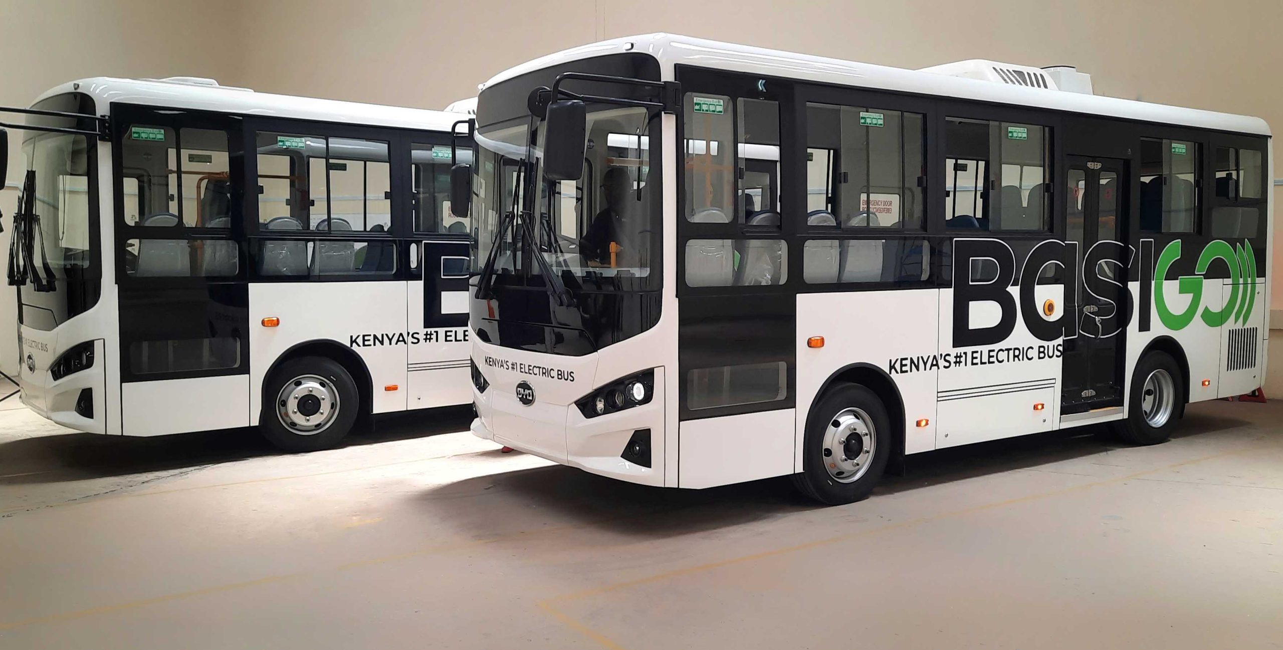BasiGo electric buses parked at the company’s Nairobi facility as deployments expand across commuter routes in Kenya and Rwanda.