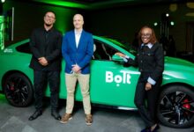Bolt South Africa senior operations managers Simo Kalajdzic and Graham Walker stand with Bolt Regional Director for Rides Africa and International Markets Caroline Wanjihia during the company’s electric vehicle launch event in Cape Town.