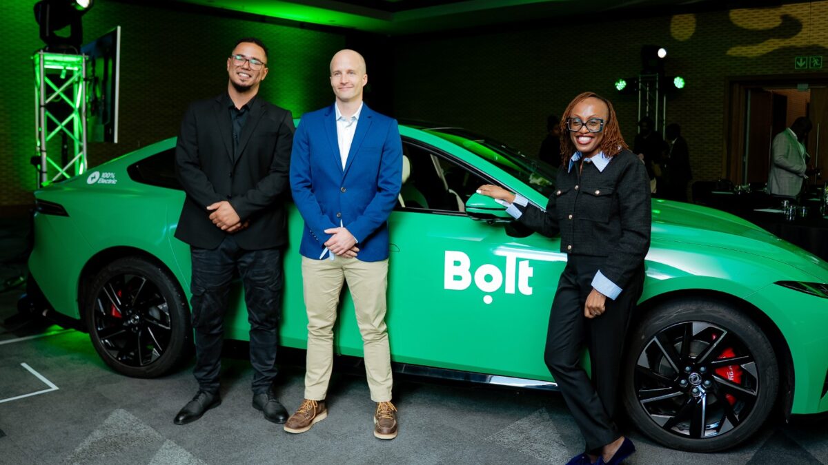 Bolt South Africa senior operations managers Simo Kalajdzic and Graham Walker stand with Bolt Regional Director for Rides Africa and International Markets Caroline Wanjihia during the company’s electric vehicle launch event in Cape Town.