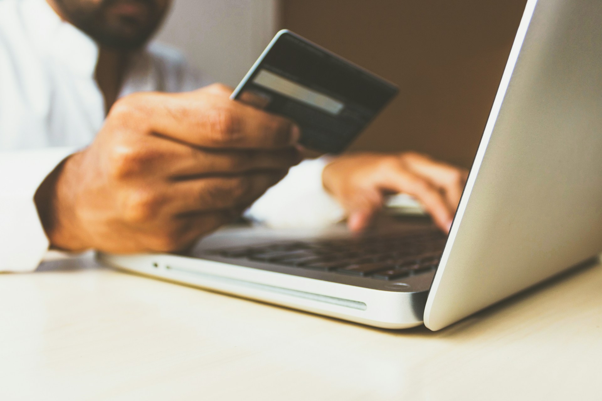A customer uses a bank card to complete an online payment, reflecting the growing role of digital transactions in Kenya’s economy.