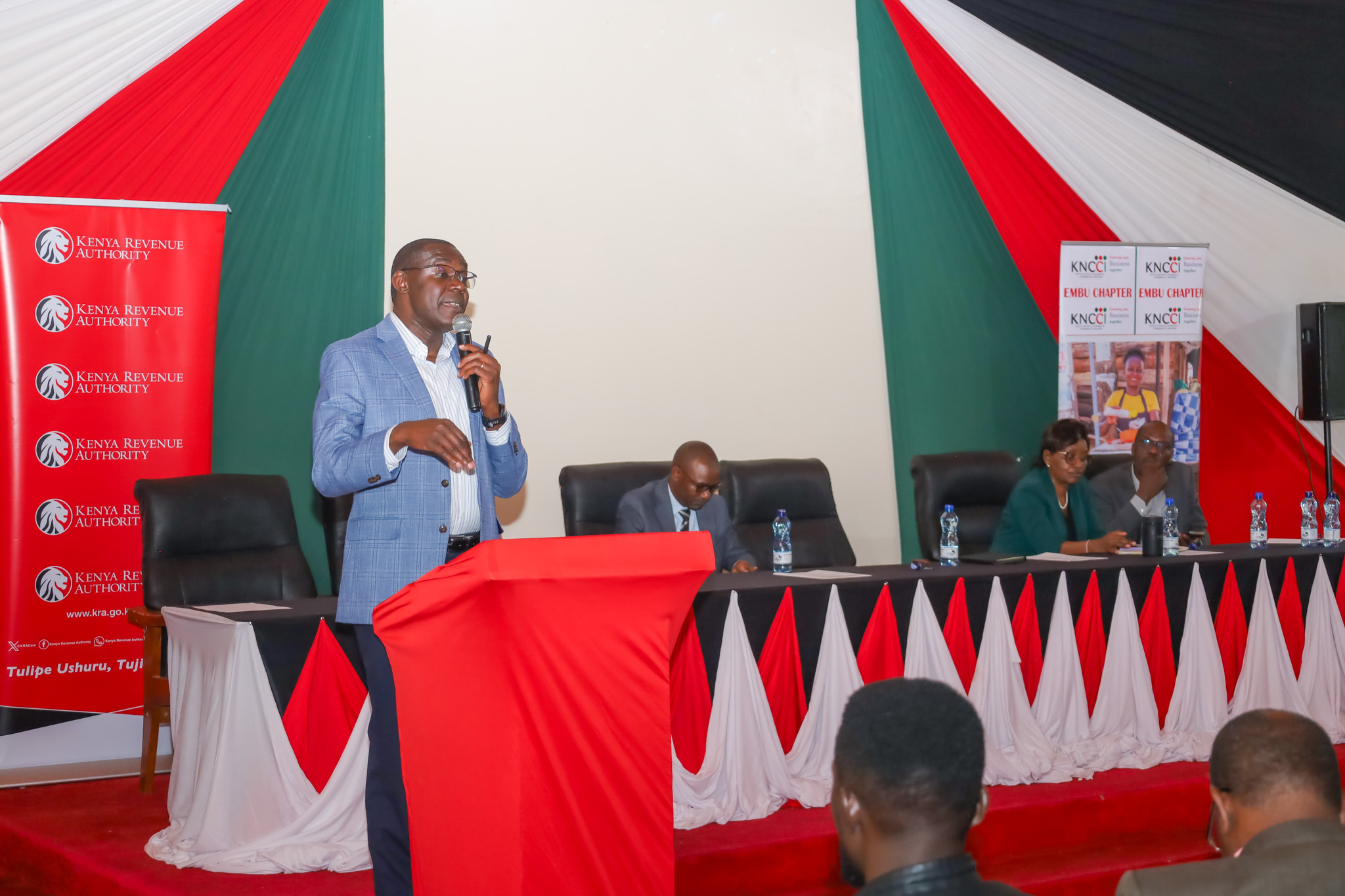 KRA Commissioner for Micro and Small Taxpayers George Obell speaks during a taxpayer engagement forum on digital tax compliance and mobile money transactions.