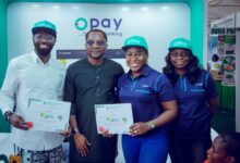 Representatives of OPay pose during an industry exhibition in Nigeria as the fintech company advances plans for a potential US public listing.