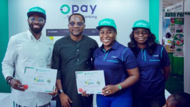 Representatives of OPay pose during an industry exhibition in Nigeria as the fintech company advances plans for a potential US public listing.