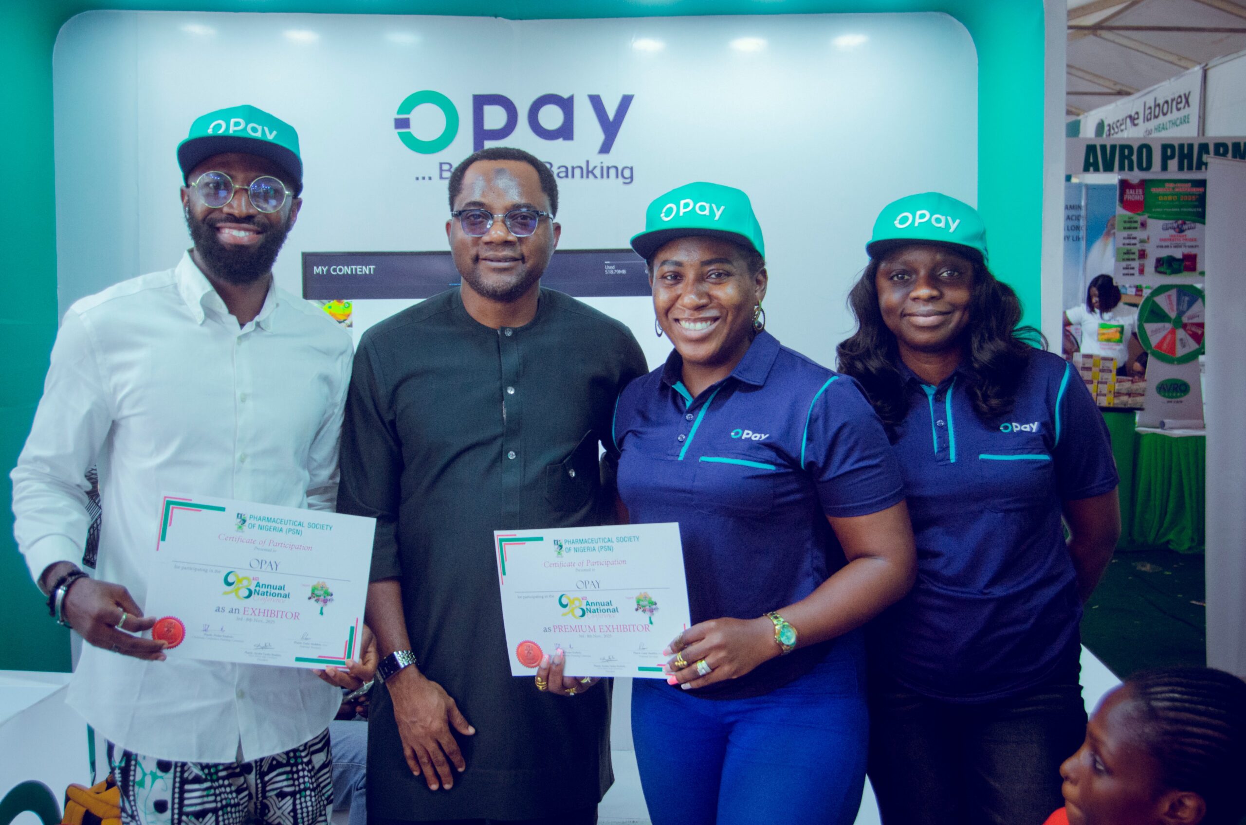 Representatives of OPay pose during an industry exhibition in Nigeria as the fintech company advances plans for a potential US public listing.