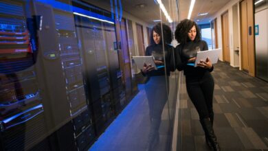 A technology worker inside a modern data centre facility as financial services firms drive rising cloud and infrastructure demand across Africa.