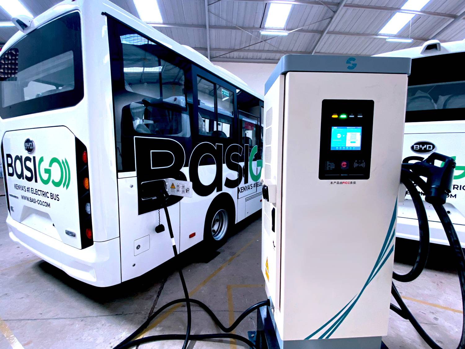 A BasiGo electric bus charging at one of the company’s EV infrastructure sites as charging corridors expand beyond Nairobi into regional towns including Nakuru, Nyeri and Meru.