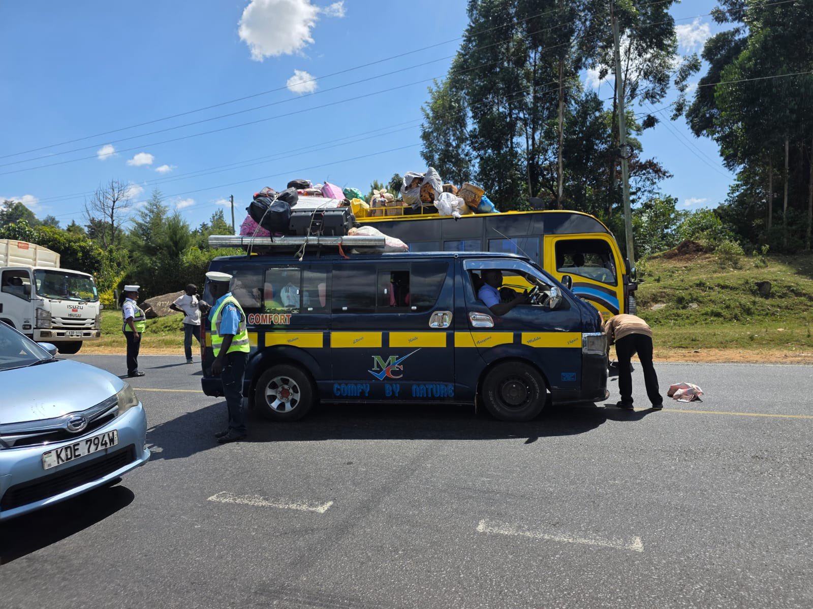 NTSA officers inspect public service vehicles during a roadside compliance exercise as Kenya prepares for expanded digital transport and vehicle verification systems.