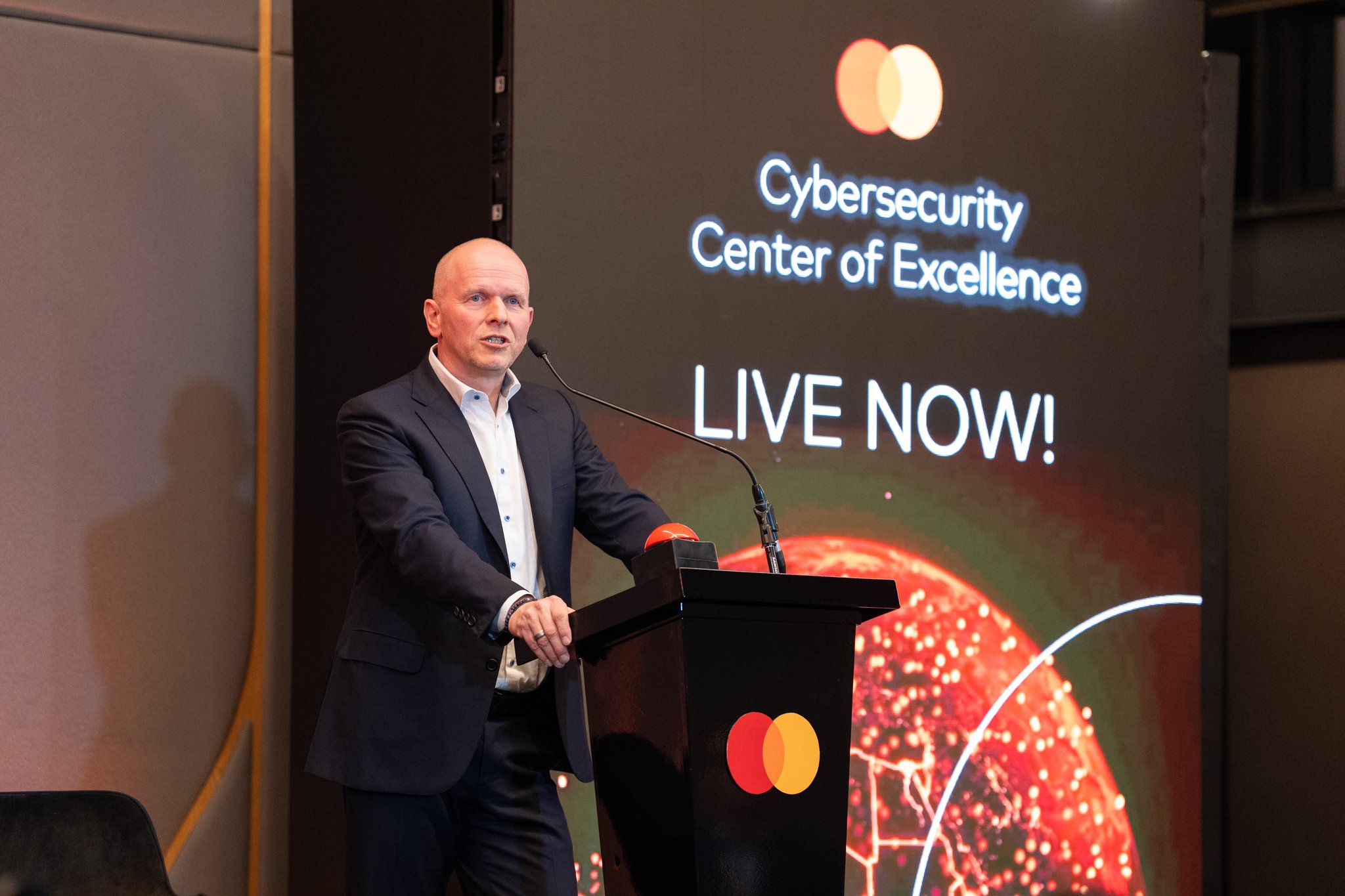 Mastercard CEO Michael Miebach announces the Africa Cybersecurity Center of Excellence during the initiative's launch event.