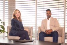 Ria Pinto of IBM South Africa and Saireshan Govender of Blue Pearl standing together during a discussion on enterprise software modernization and AI-driven development.