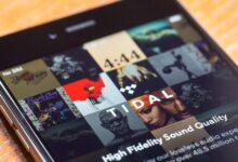 A smartphone displaying the TIDAL music streaming app as the platform rolls out artist-controlled AI-generated music royalty settings.