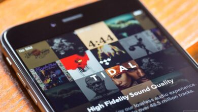 A smartphone displaying the TIDAL music streaming app as the platform rolls out artist-controlled AI-generated music royalty settings.