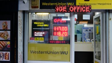 Western Union money transfer office with exchange rate display and remittance service signage.