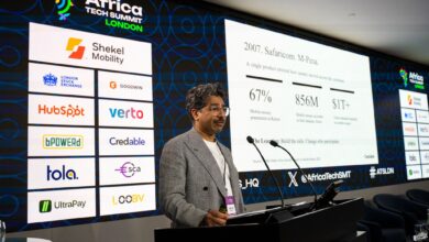 Nadeem Juma presenting at Africa Tech Summit London with slides on M-Pesa, mobile money growth, and African credit infrastructure.