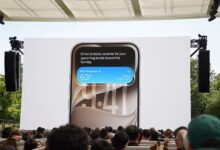 Large screen at WWDC 2026 displaying Siri AI on an iPhone during Apple's iOS 27 announcement.