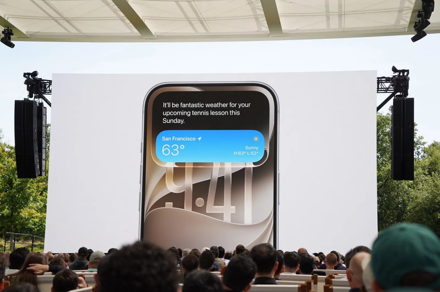 Large screen at WWDC 2026 displaying Siri AI on an iPhone during Apple's iOS 27 announcement.