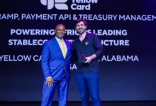 Chris Maurice of Yellow Card stands on stage holding the Grand Prix Payments Award at Money20/20 USA.