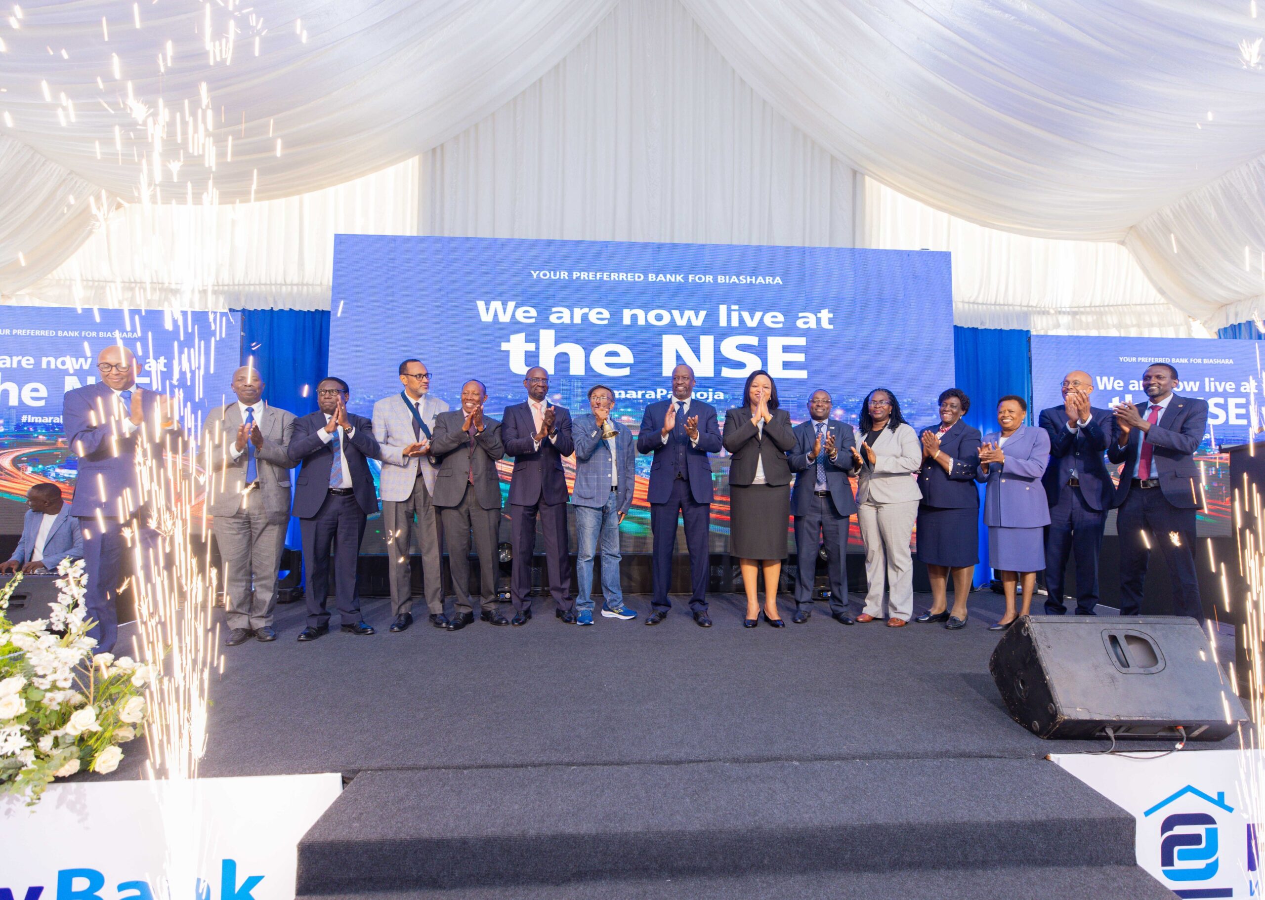 Family Bank executives, NSE officials, transaction advisors and board members celebrate the lender's admission to the Nairobi Securities Exchange during a listing ceremony in Nairobi.