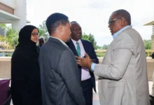 Members of a parliamentary finance team confer during deliberations on revenue proposals and tax policy changes under consideration.
