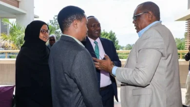 Members of a parliamentary finance team confer during deliberations on revenue proposals and tax policy changes under consideration.