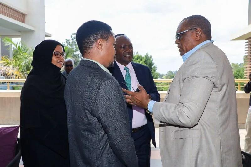 Members of a parliamentary finance team confer during deliberations on revenue proposals and tax policy changes under consideration.