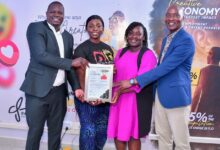Officials present a certificate to a participant during the Jitume Digital Media Tools Sensitization Workshop graduation in Nairobi, recognizing digital media and AI skills training.