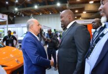 Simba Corp executives present MG electric vehicles to Energy Principal Secretary Alex Wachira at the E-Mobility Stakeholders Conference in Nairobi.