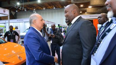 Simba Corp executives present MG electric vehicles to Energy Principal Secretary Alex Wachira at the E-Mobility Stakeholders Conference in Nairobi.