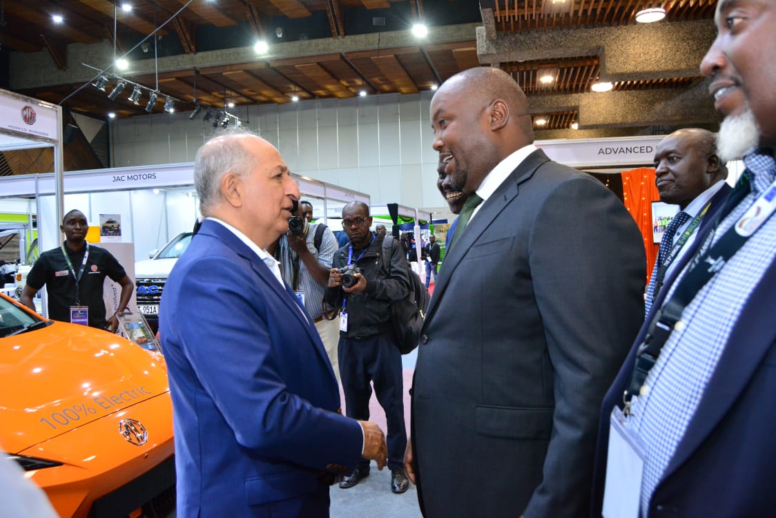 Simba Corp executives present MG electric vehicles to Energy Principal Secretary Alex Wachira at the E-Mobility Stakeholders Conference in Nairobi.