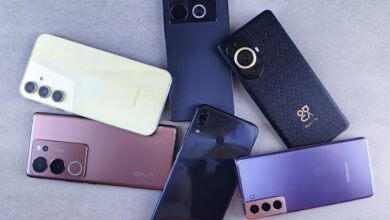 Several smartphones arranged on a surface, illustrating Kenya's debate over proposed mobile phone tax changes under the Finance Bill 2026.